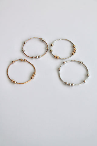 four fidget spinner rings on a white background