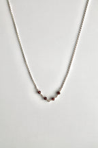 Collar con barra de piedra natal - Granate (enero) - Manifestación