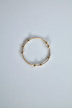gold fidget spinner ring on a white background