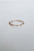 Gold ring on a light gray background