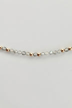 3mm round labradorite gemstone and gold bead bracelet on a white background 