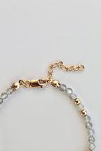 3mm labradorite gemstone and gold bead bracelet with close-up of the clasp and extender chain on a white background