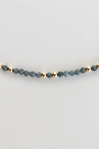3mm sapphire gemstone gold bead bracelet on a white background