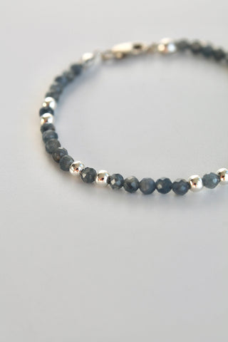3mm sapphire gemstone silver bead bracelet close-up of the left side of the bracelet on a white background
