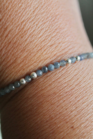 3mm sapphire gemstone and silver bead bracelet close-up on a wrist
